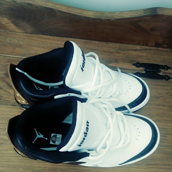 white jordans with gold trim